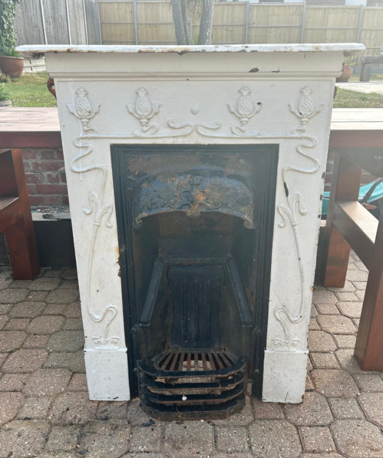 Antique original Victorian cast iron fireplace with attractive period detail 