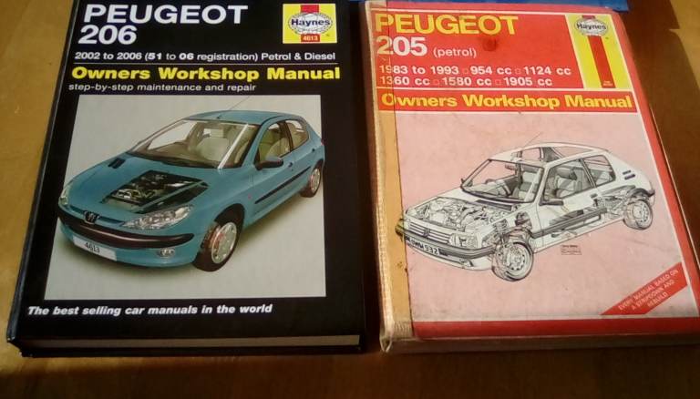 Large collection of vintage car repair manuals