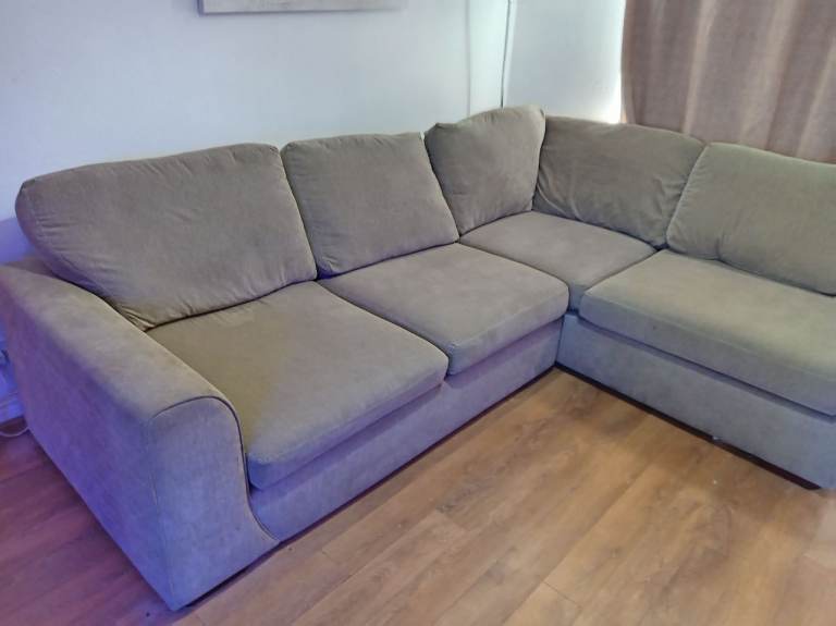 Corner sofa with foot stool storage
