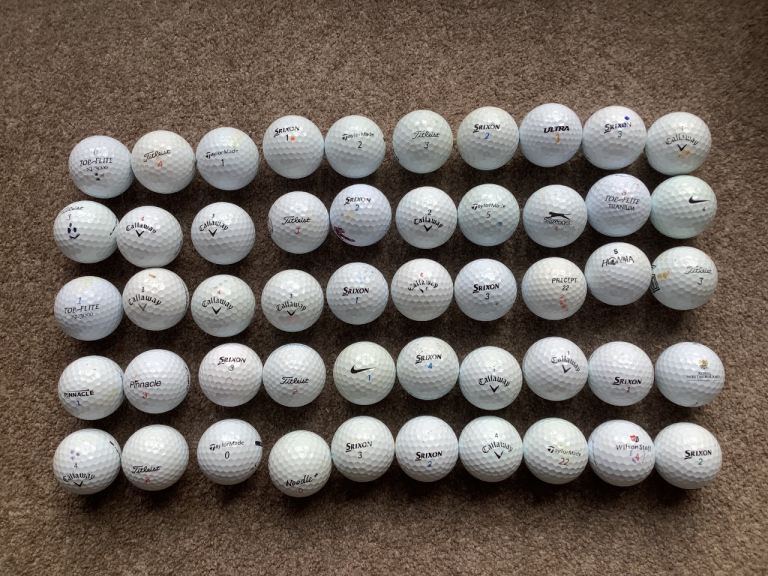 50 used golf balls