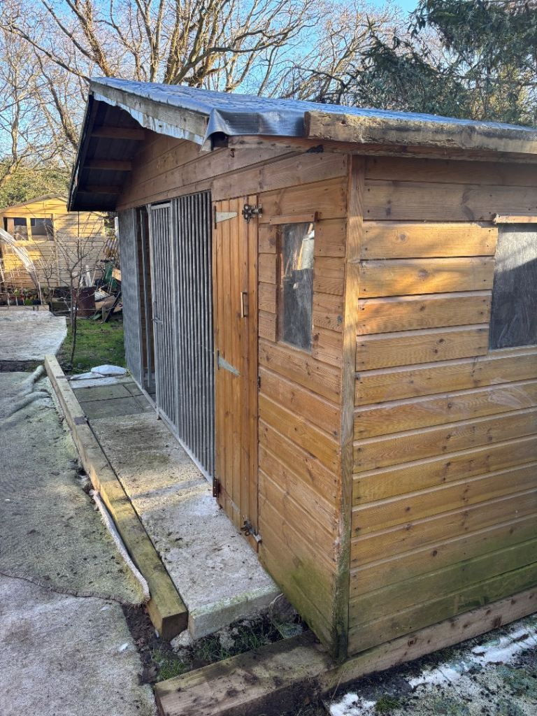 Dog kennel with covered area. 
