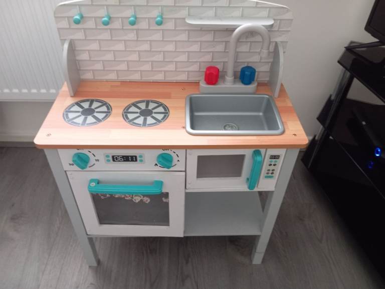 Kitchen unit girl playing 