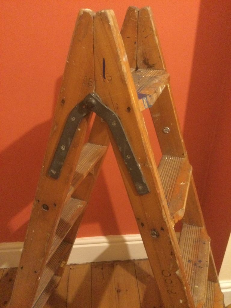 Old wooden step ladders . 