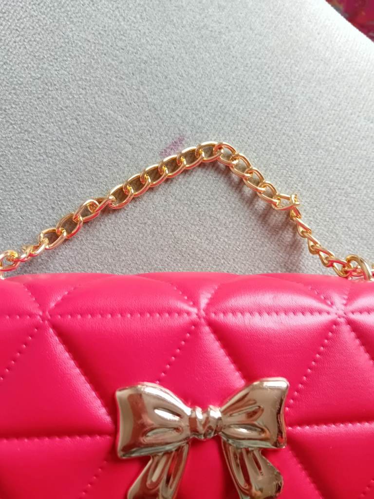 Quilted red Handbag with Gold Chain and Bow Detail