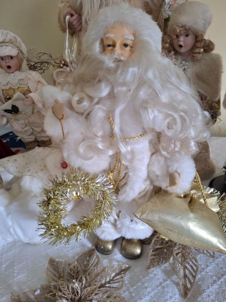 Collection of mainly cream Christmas figures