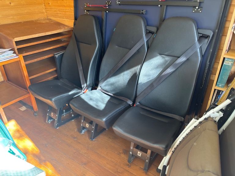 Individual belted seats for a van 