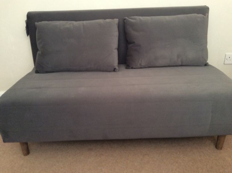 Hardly used Logan M&S double size sofa bed. In dark grey