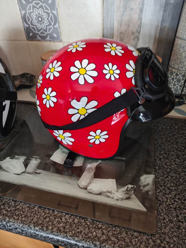 2 open faced helmets 
