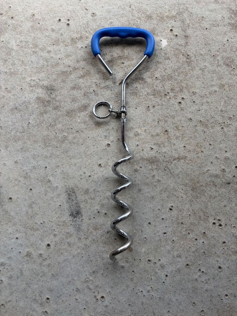 Metal dog tie-out stake with blue handle