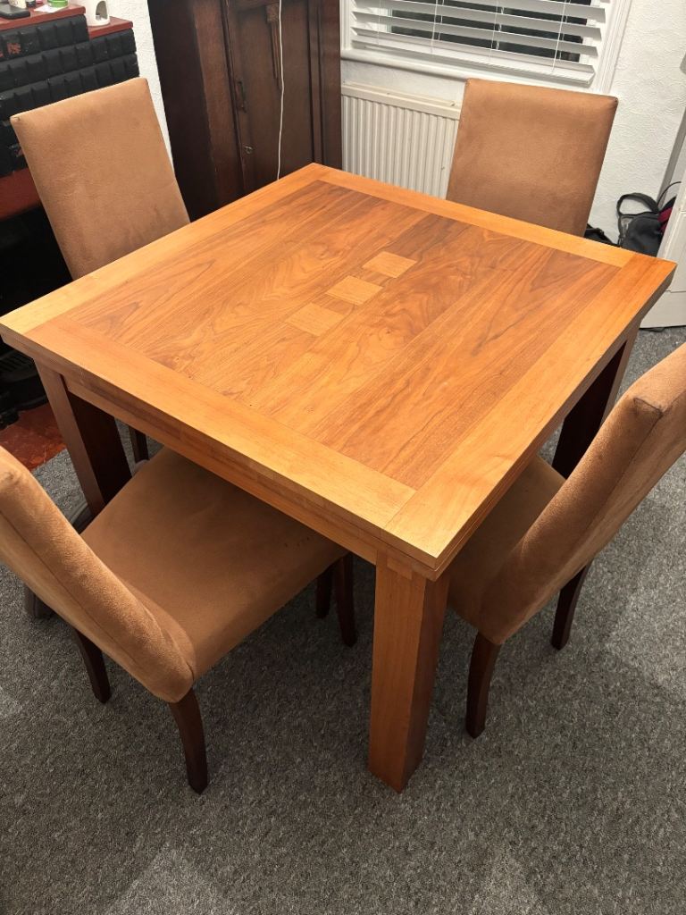 Solid oak extendable dining table and chairs 