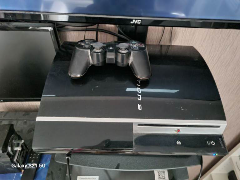PlayStation 3 with seven games and controller 