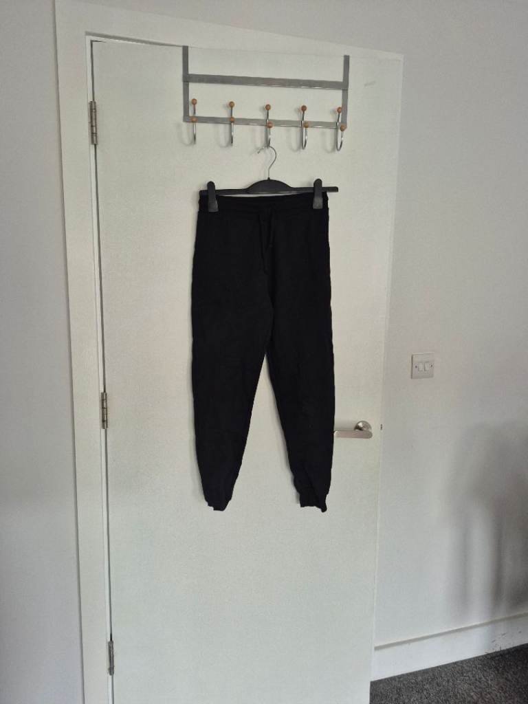 A pair of joggers black and grey