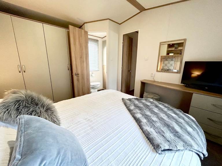 Own a caravan, repaying monthly, near Gt Yarmouth and Lowestoft