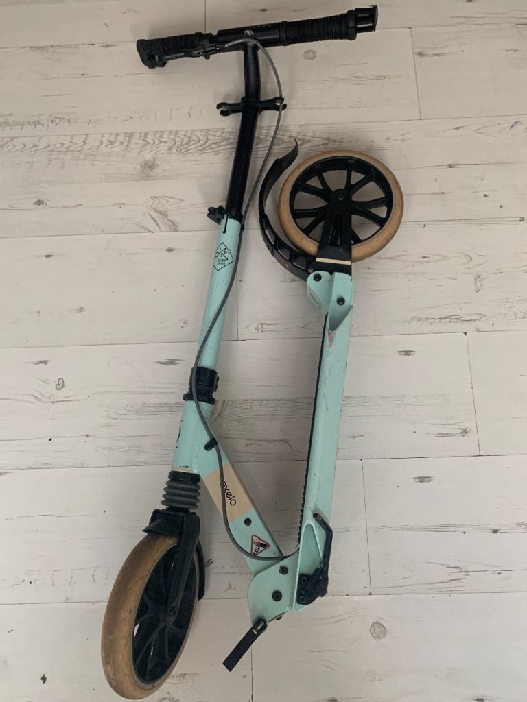 Light Blue Folding Scooter with Hand Brake – Good Condition