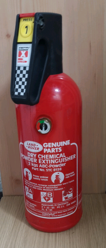 Land Rover Fire Extinguisher. Dry powder. 2kg. Tamper seal still fitte