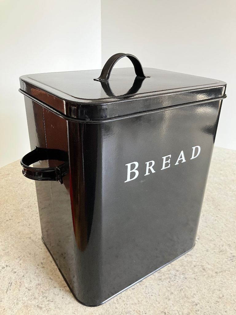 Traditional black metal bread bin