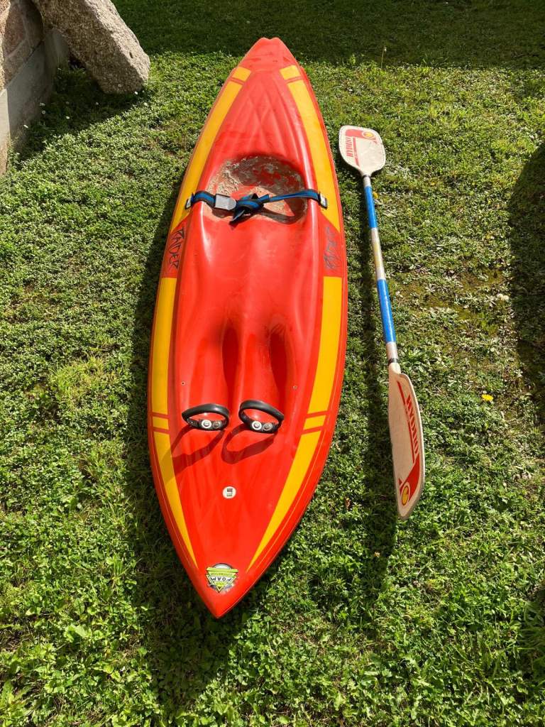 Swallow tail surf ski with paddle.