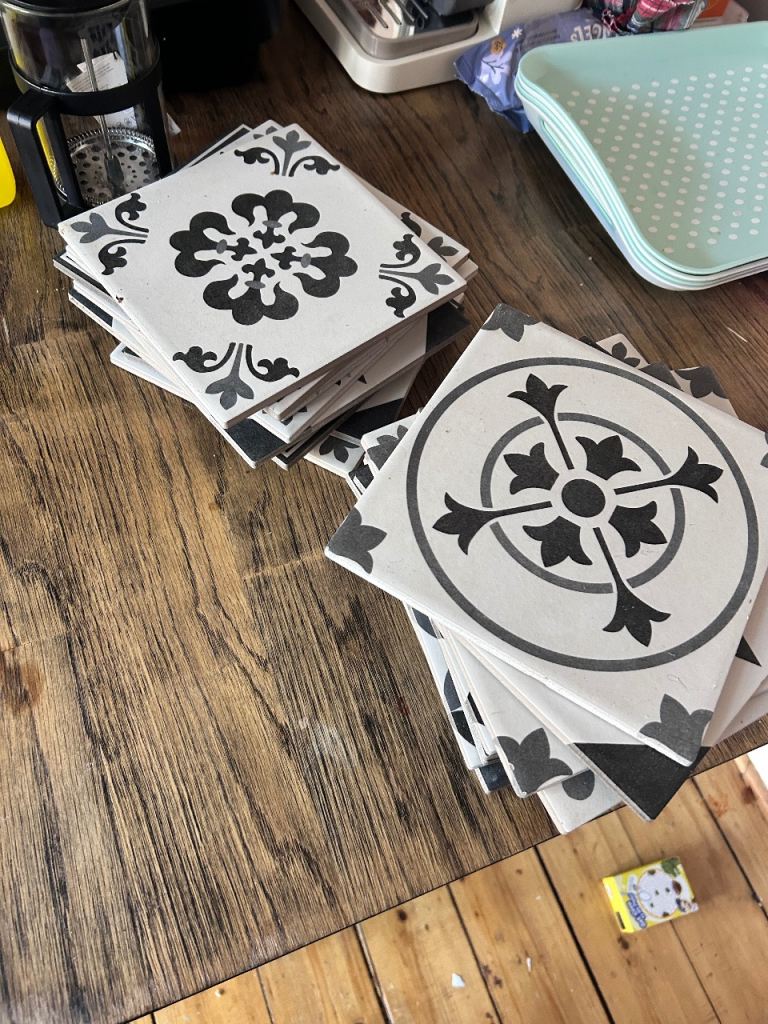 25 ceramic floor tiles.