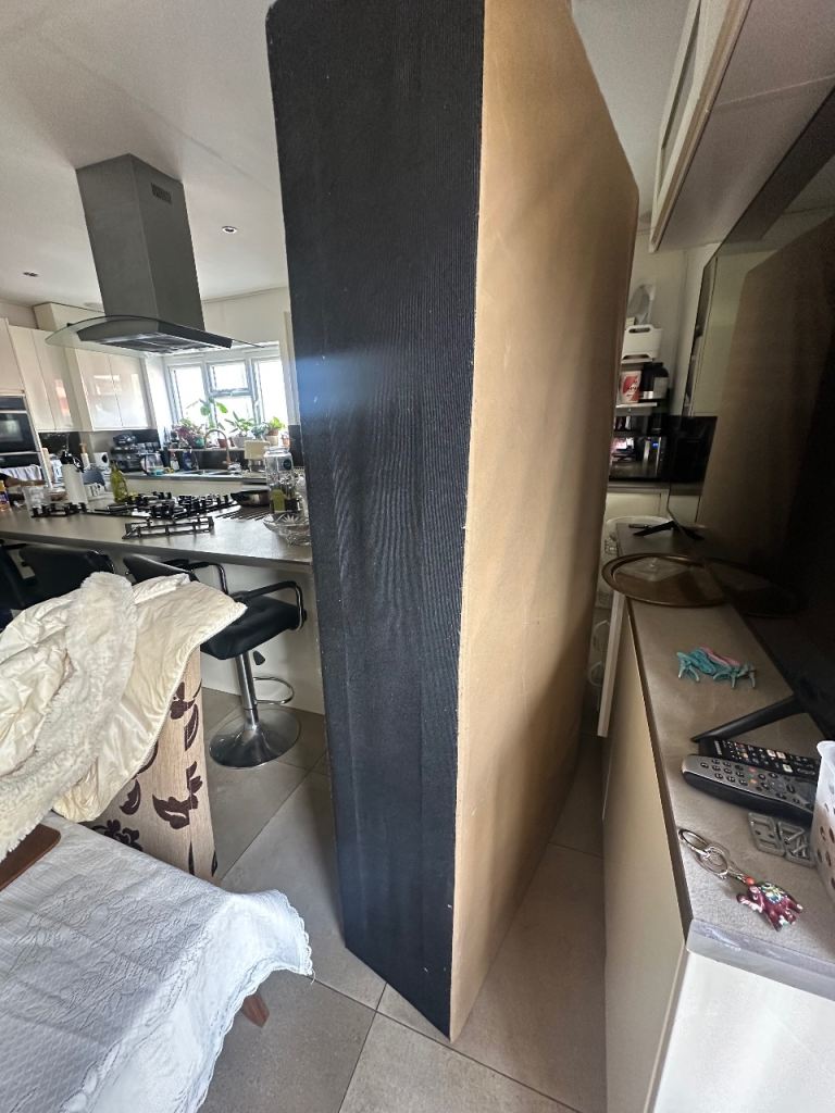 A pair of Single beds and ironing board