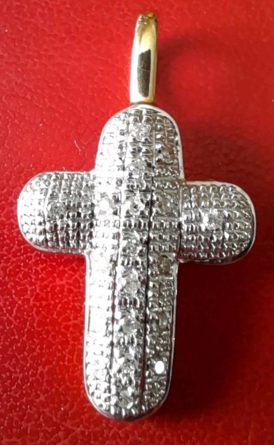 Diamond and gold cross pendant