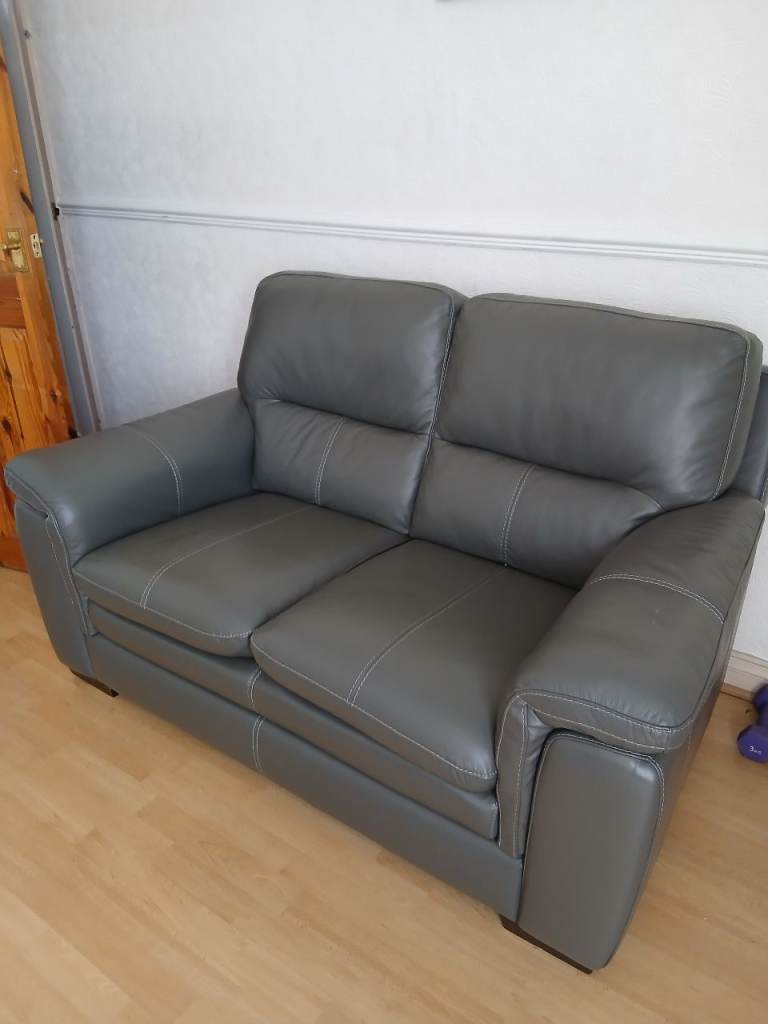 Grey 2 seater and arm chair