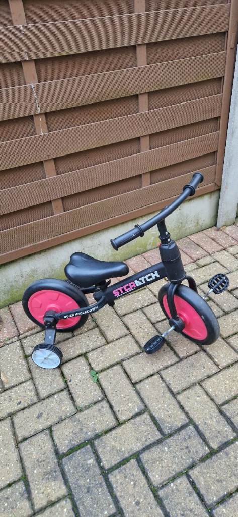 CHILDS BALANCE BIKE WITH REMOVEABLE STABILISERS. EXCELLENT CONDITION.