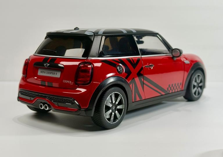 New red 1:18 scale diecast model of a MINI Cooper S