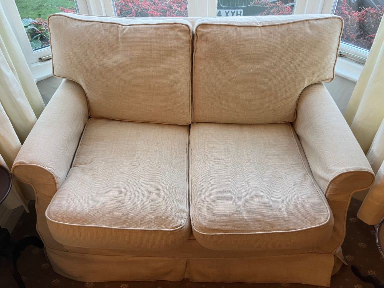 Cream 2 seater settee. 