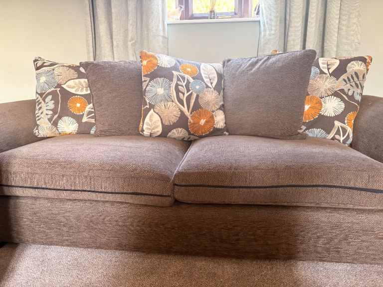 Comfortable Fabric Sofa with Patterned Cushions – Good Condition