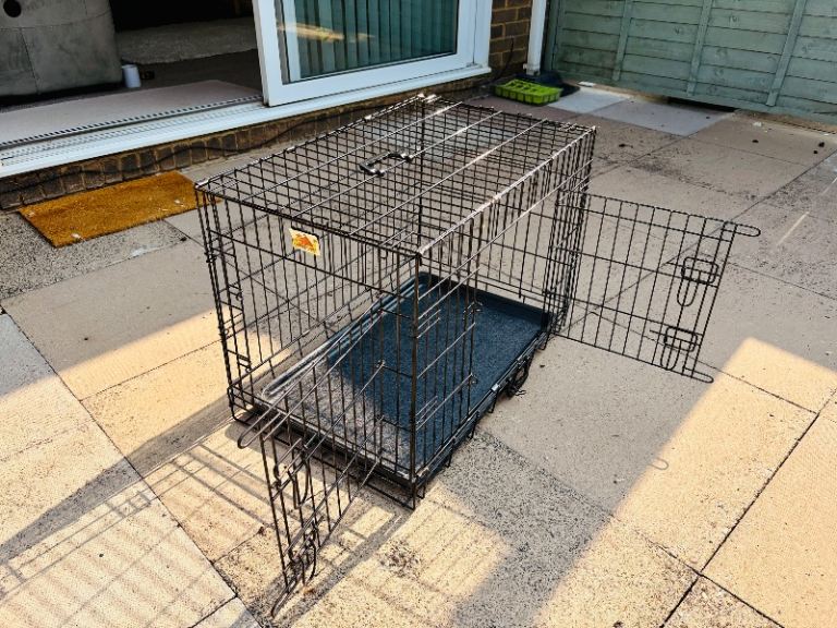 Dog cage two separate doors folding complete with two pet mats 