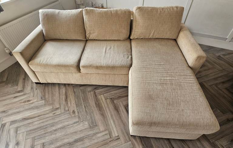 Beige corner sofa bed with storage