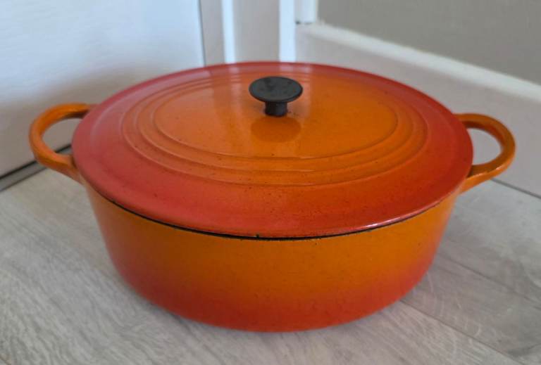 Le Creuset enameled cast-iron Volcanic Flame orange casserole pot