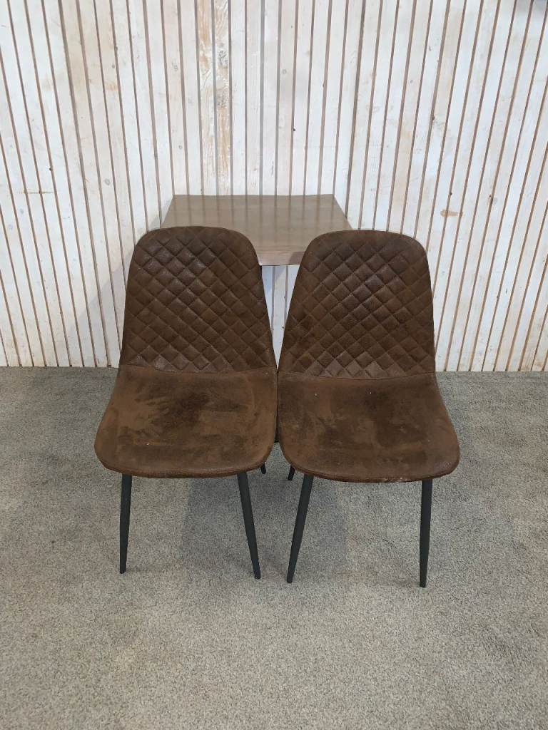 Bistro Dining Table with two Chairs, featuring Square Bown Faux-Suede Seats .