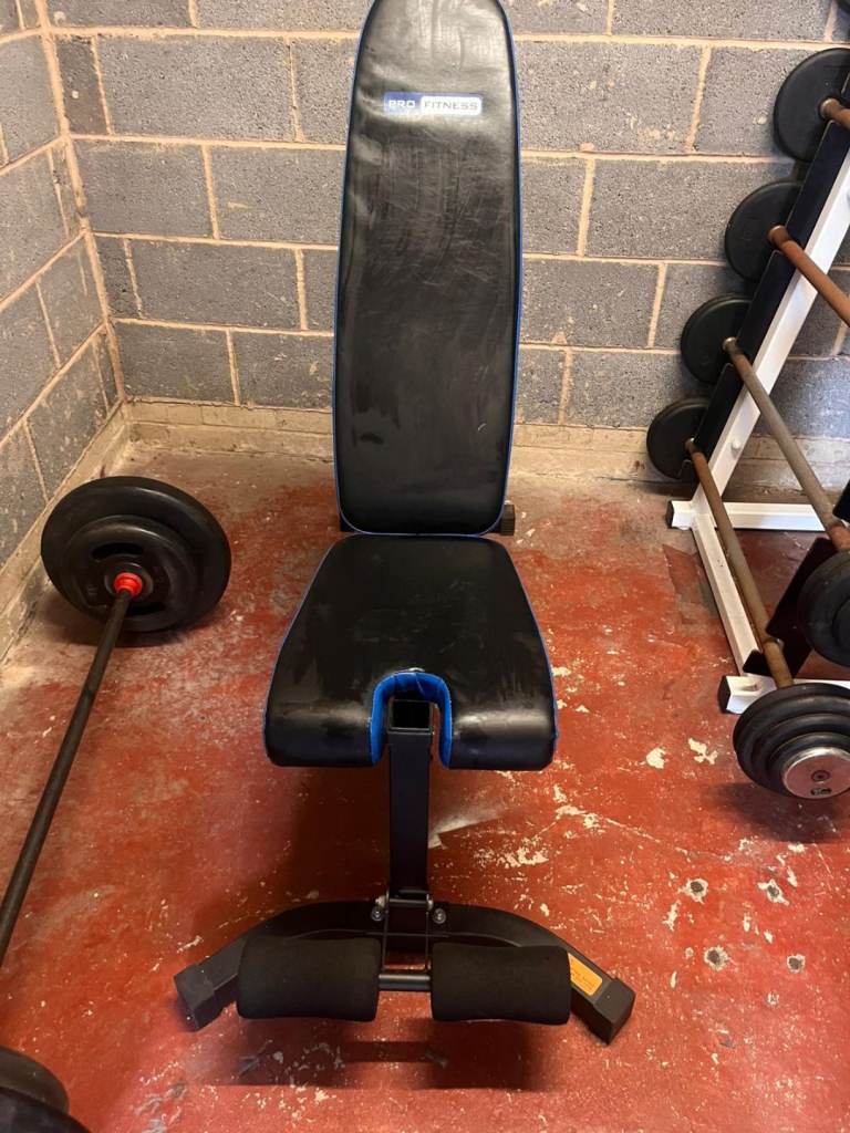 Multi use weights bench, preacher curls built in with the barbell seen on the left of the photos