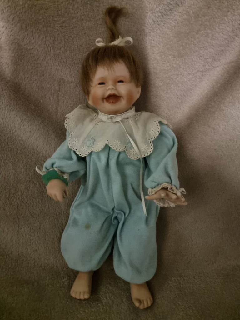 Collector’s doll and clthes and accessories 