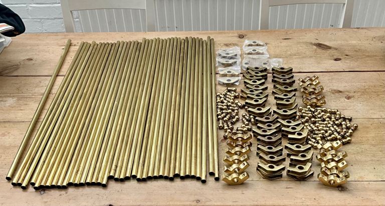 Brass stair rods with finials and brackets 