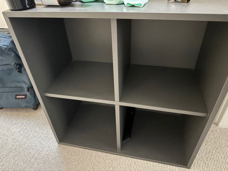 Grey Storage Unit with 4 Cubbies – Good Condition