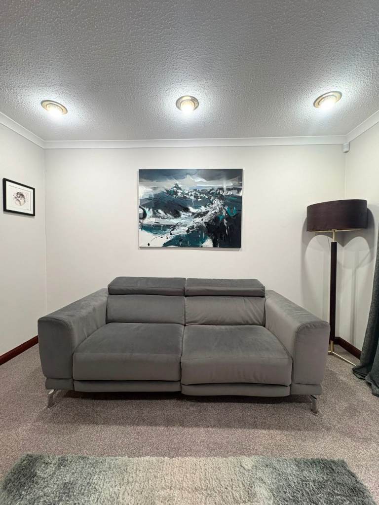 Three-Seater Grey Electric Recliner Sofa – Good Condition