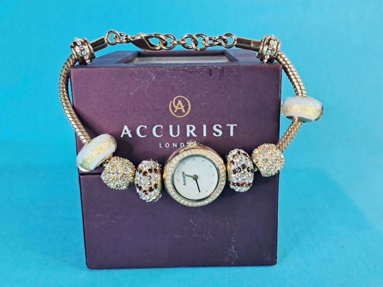 Accurist Charmed ladies' gold-tone bracelet watch.( Working perfect-just need change battery.