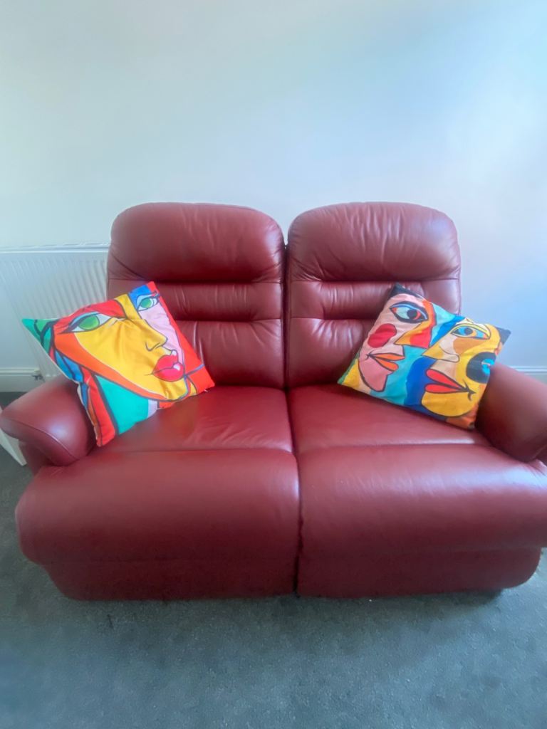 Red Leather Two-Seater Sofa with Footstool – Good Condition