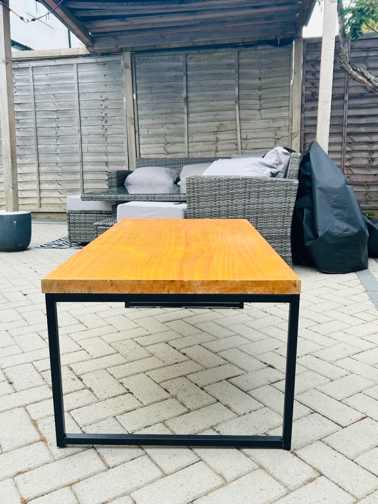 Wooden coffee table with black legs
