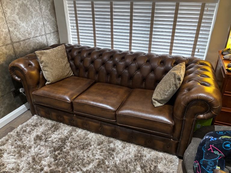 Brown Chesterfield antique colour 3 seater double sofa bed.