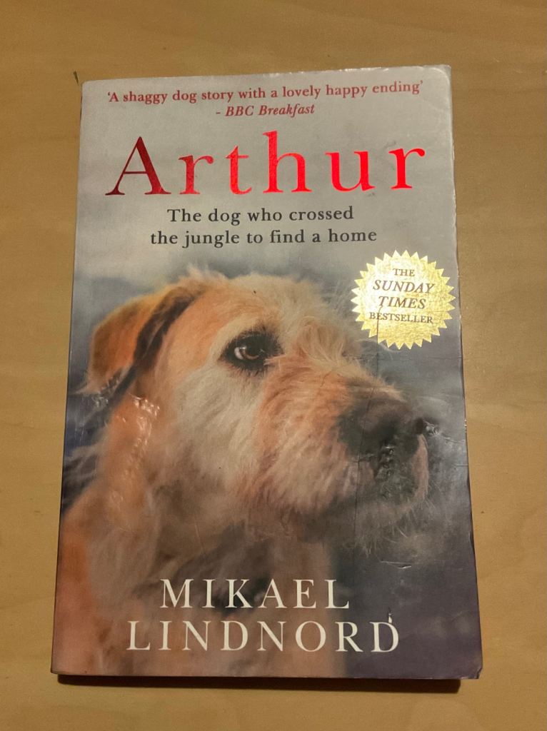 AS NEW BOOK: ARTHUR - THE DOG WHO CROSSED A JUNGLE TO FIND A HOME (Mikael Lindnord)