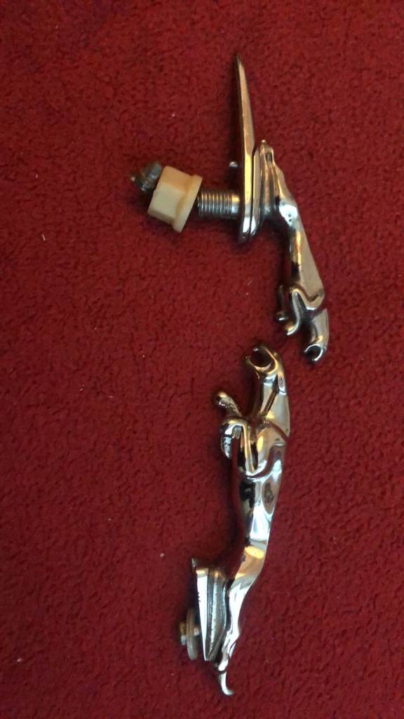 Vintage Jaguar car leaper emblems