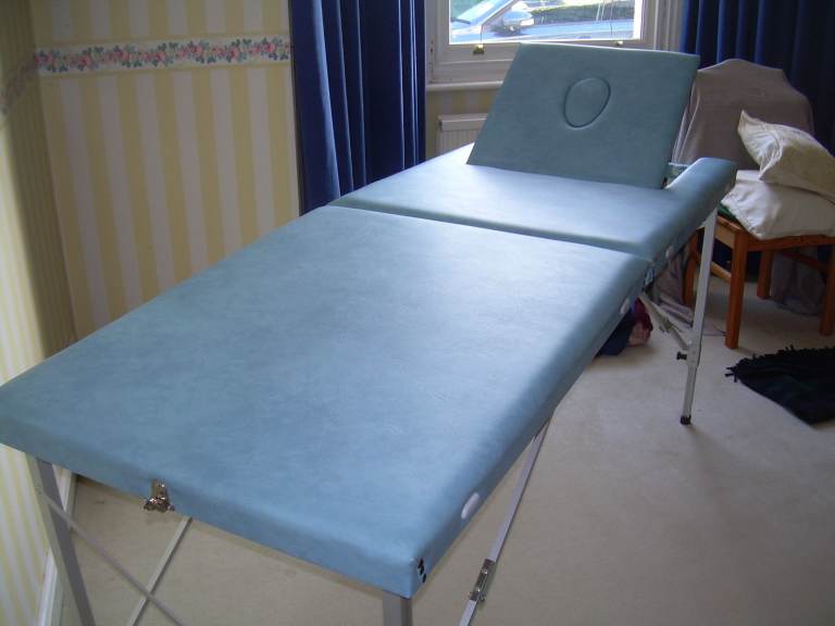 Portable massage and treatment couch