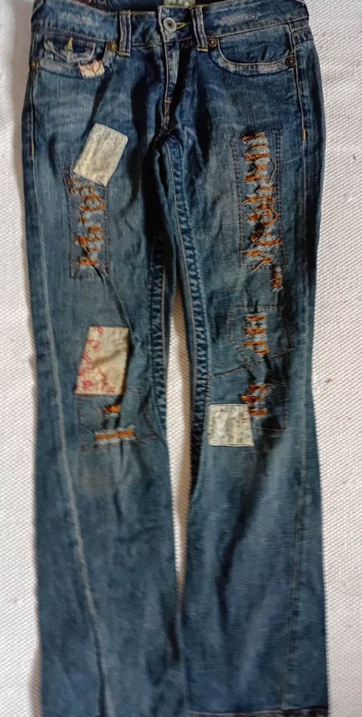 Distressed Blue Denim Jeans with Patches – Worn Look