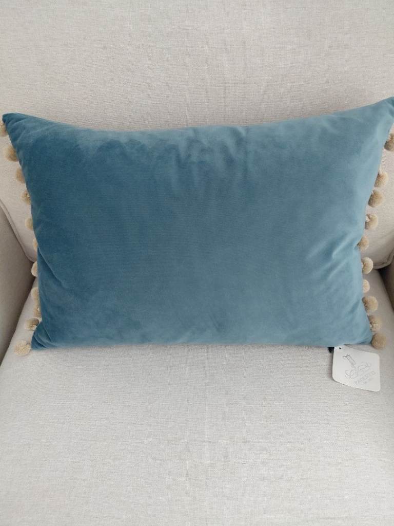 BRAND NEW. Paoletti Fiesta Soft Velvet Pom Pom Trimmed Cushion. 35cm x 50. RRP £25