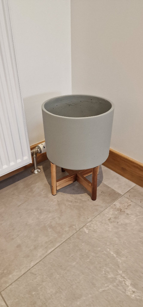 Concrete planter on wooden stand