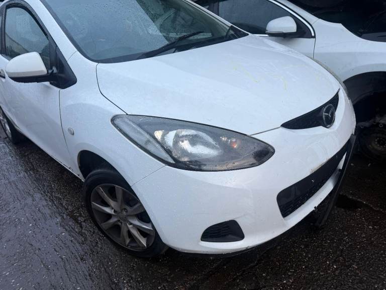 Breaking spare parts mazda 2 white