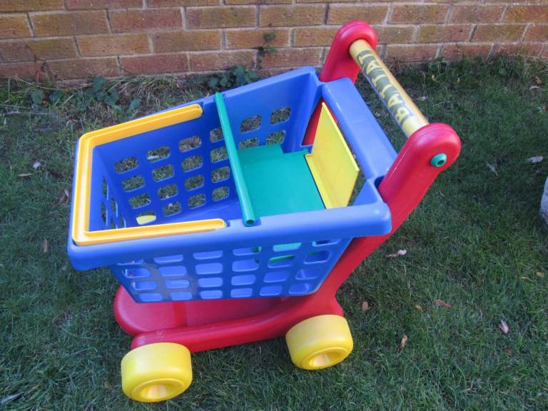 Child's large shopping trolley. Removable basket & seat for teddy/doll